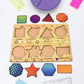 Wooden Triangle Puzzle board with colourful geometric pieces for kids' early learning.