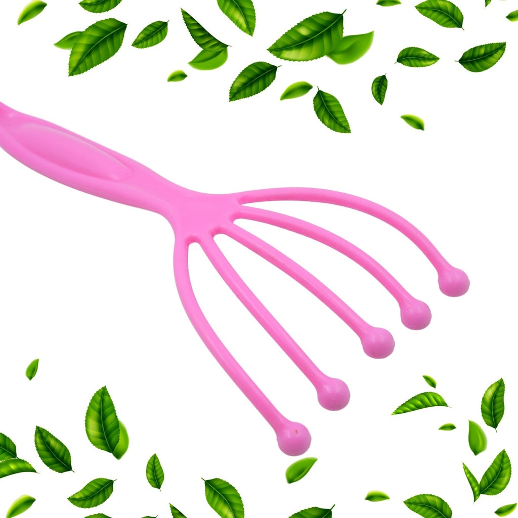 Pink scalp massager tool close-up of five prongs with small round bead tips