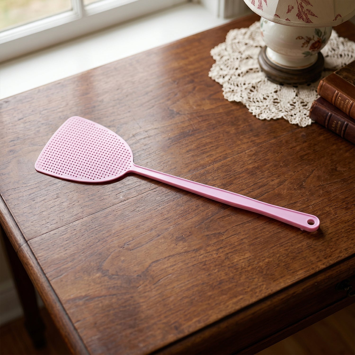 Long handle pest swatter designed for indoor and outdoor use