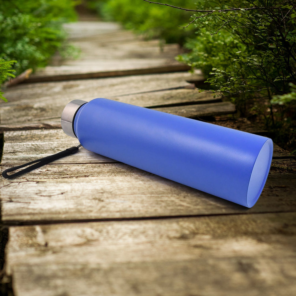 Blue stainless steel water bottle lying on side with silver lid and wrist strap