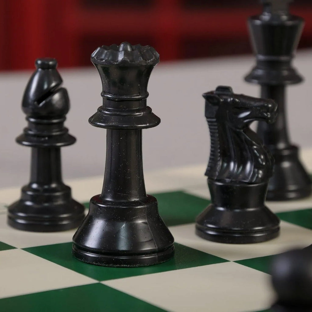 Compact vinyl chessboard for portable gameplay with plastic chess pieces