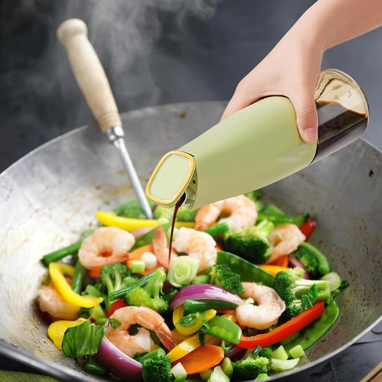 Light green squeeze sauce dispenser bottle dispensing oil over a vegetable pan