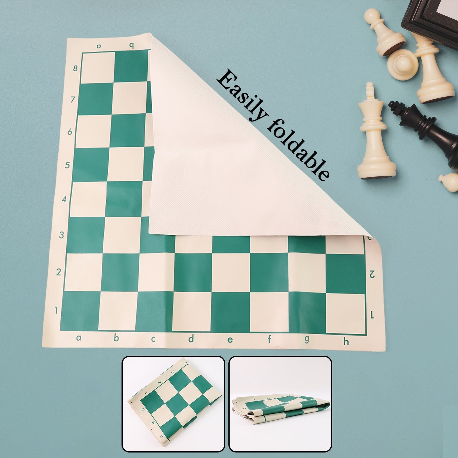 Portable vinyl chessboard spread out with plastic chess pieces arranged