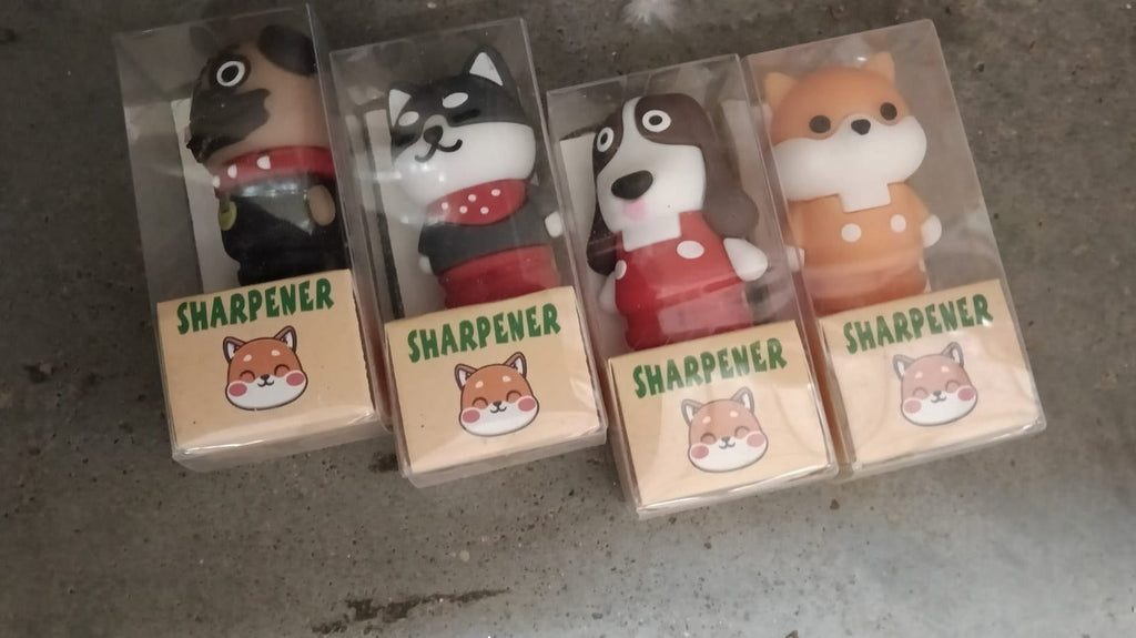 Cartoon eraser and pencil sharpener set in clear packaging with animal designs