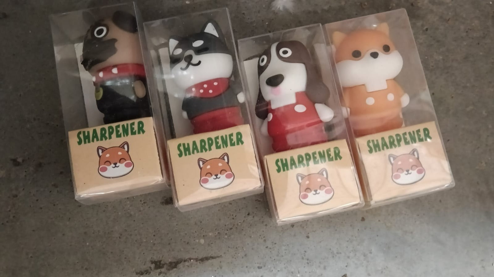 Cartoon eraser and pencil sharpener set in clear packaging with animal designs