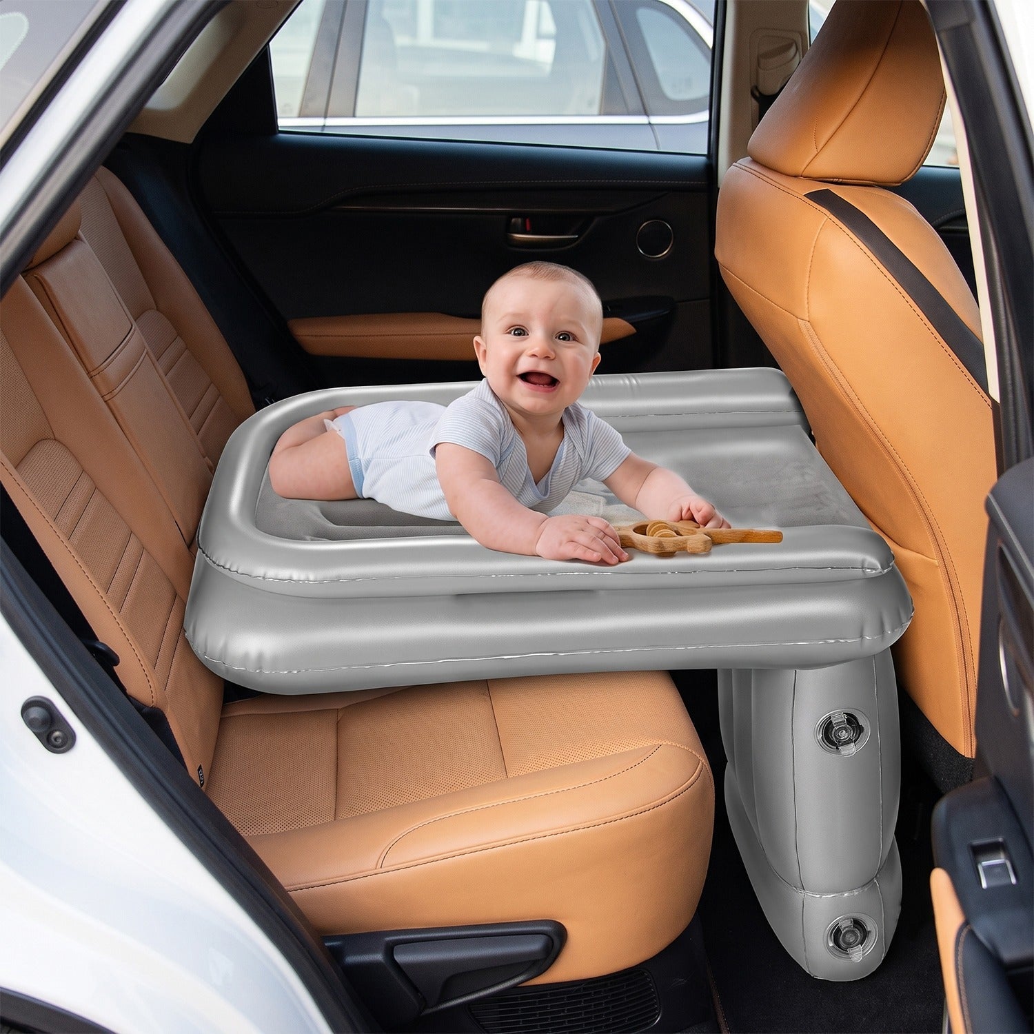 Gray inflatable car back seat air mattress in open position