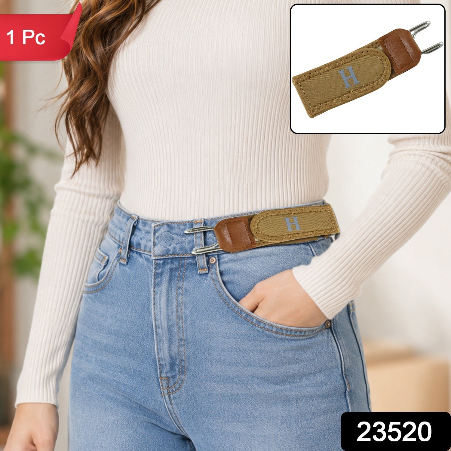 Women's tan invisible stretch belt with buckle detail across blue jeans waistband