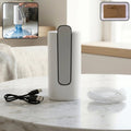 Foldable electric water dispenser pump with white body, gray top, USB cable and tube