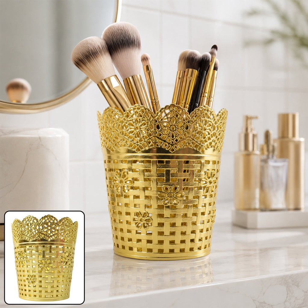Gold metal mesh makeup brush holder with decorative floral lattice design, open top