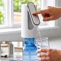 USB rechargeable electric water dispenser pump, white base, blue tank, hand-press spout