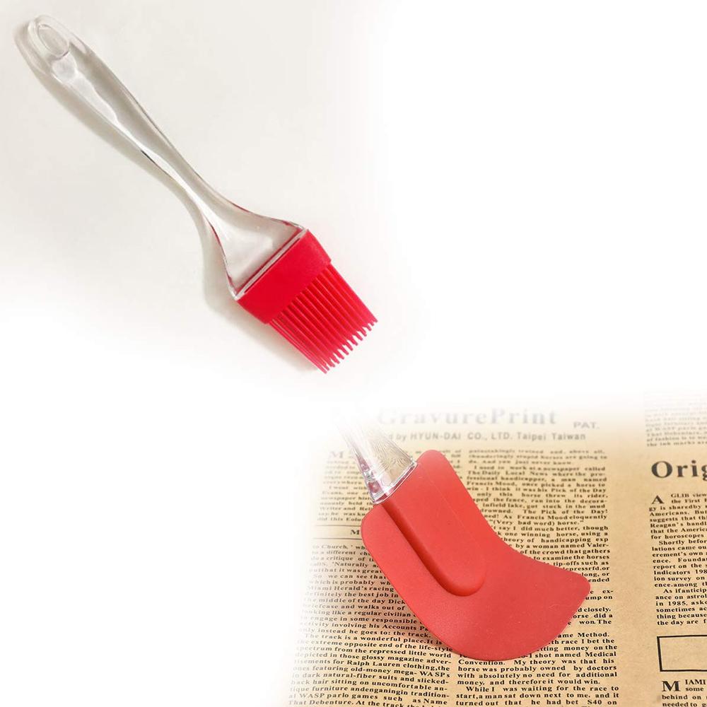 Silicone pastry spatula and brush tools with red silicone tips on clear handles
