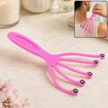 Pink scalp massager tool with five curved prongs and round bead tips