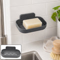 Self-adhesive wall soap dish holder with dark gray tray and upright back lip