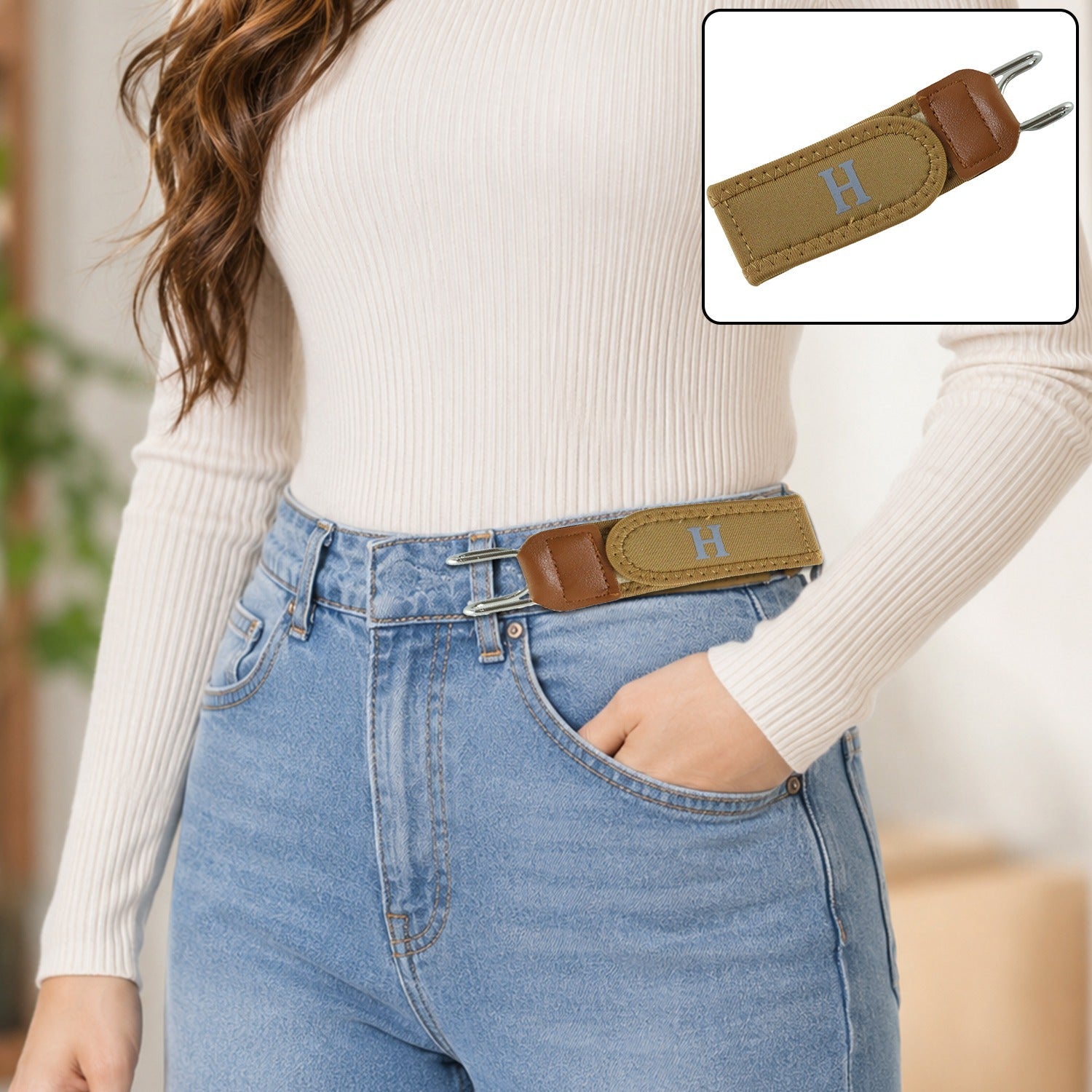 Women's tan stretch waist belt with sliding buckle on light blue jeans, no visible elastic