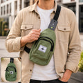Men’s green canvas sling crossbody bag with front zip pocket and adjustable black strap