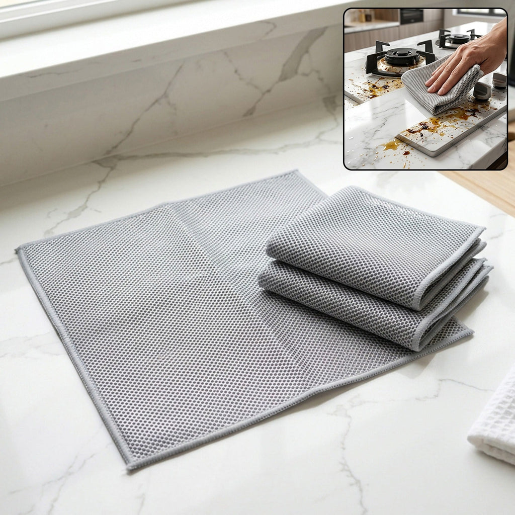 Gray microfiber cleaning towels, dual-sided weave; folded set on countertop surface