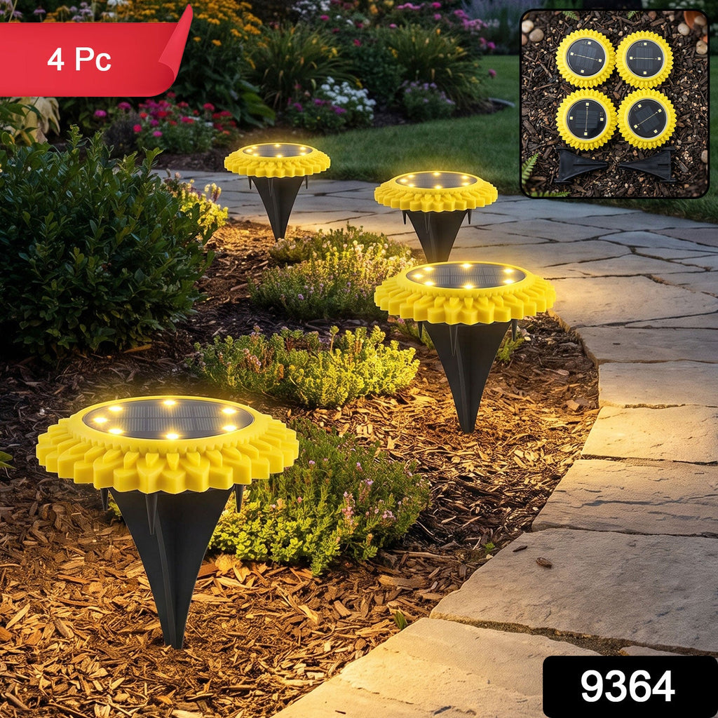 4-pack sunflower solar stake lights with warm glowing LED discs along a walkway