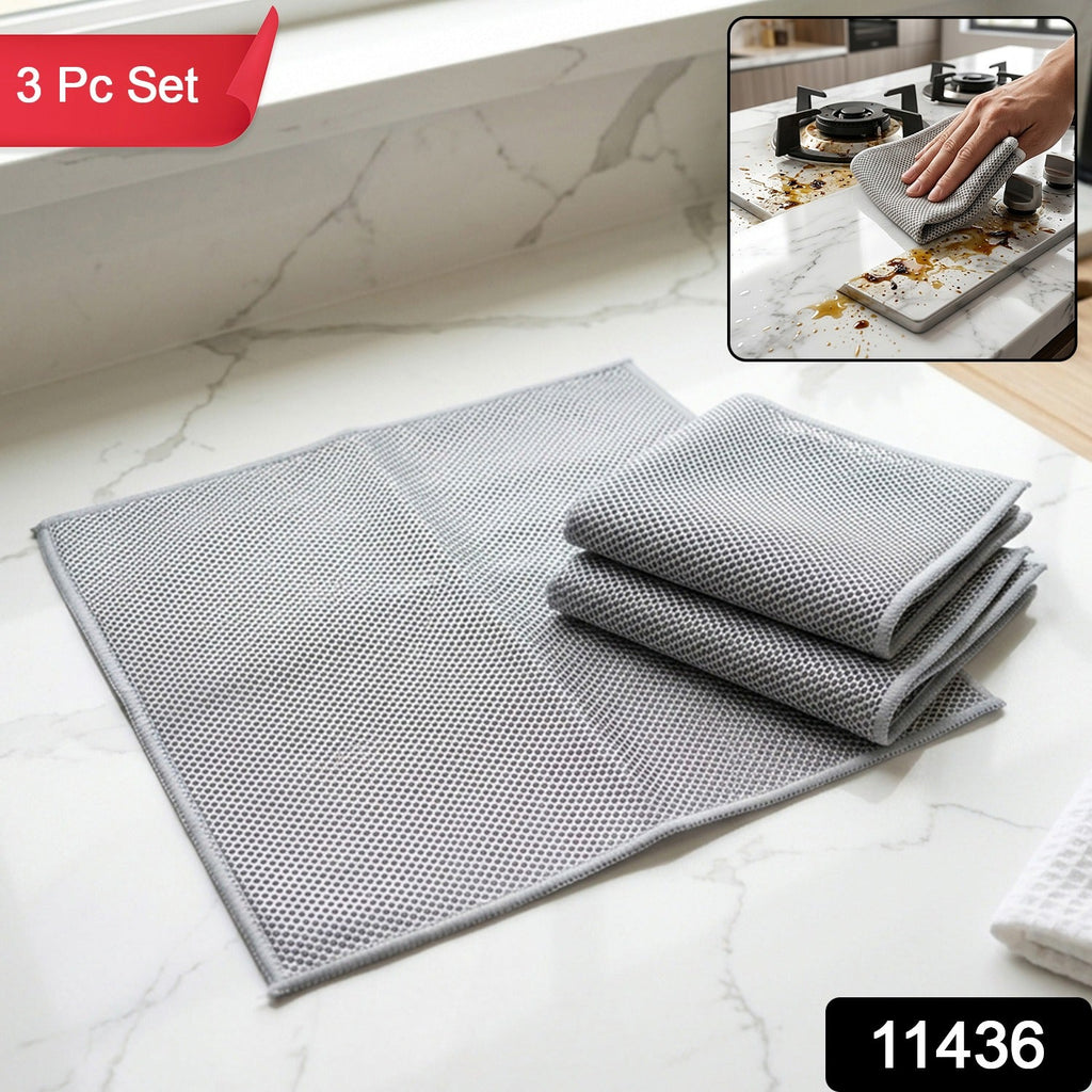 Gray dual-sided microfiber cleaning towels, 3-piece folded set on countertop surface