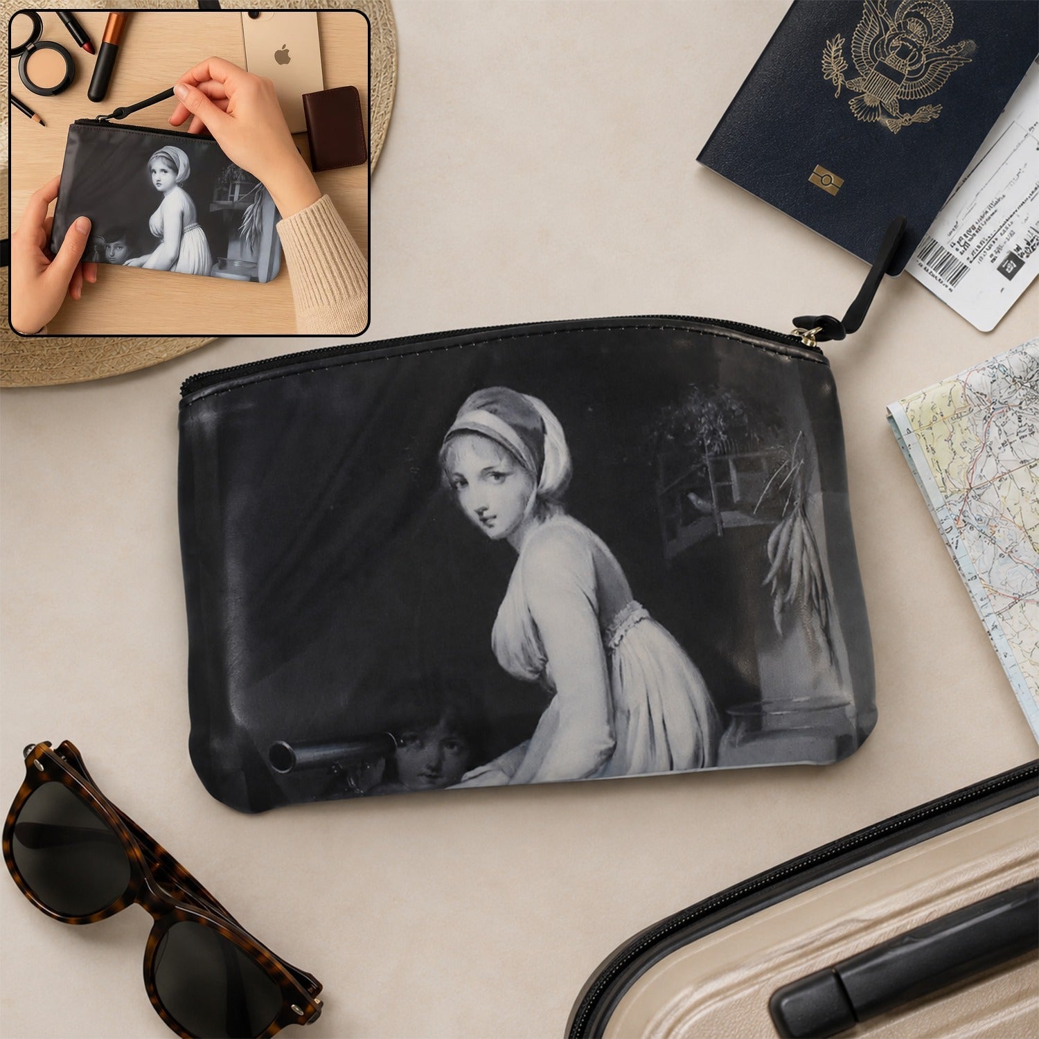 Black zippered travel pouch with monochrome woman print, round grommet detail