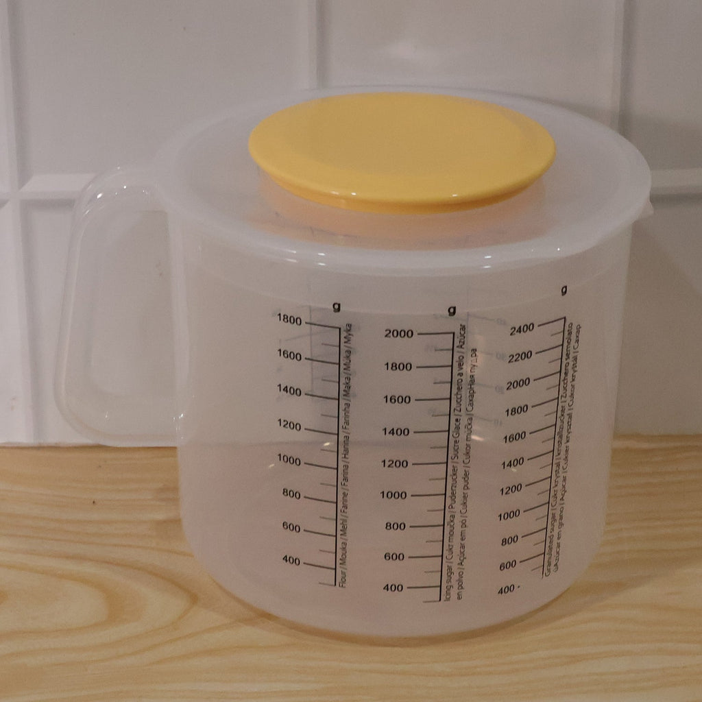 Large clear plastic measurement storage box with printed scale and yellow screw lid
