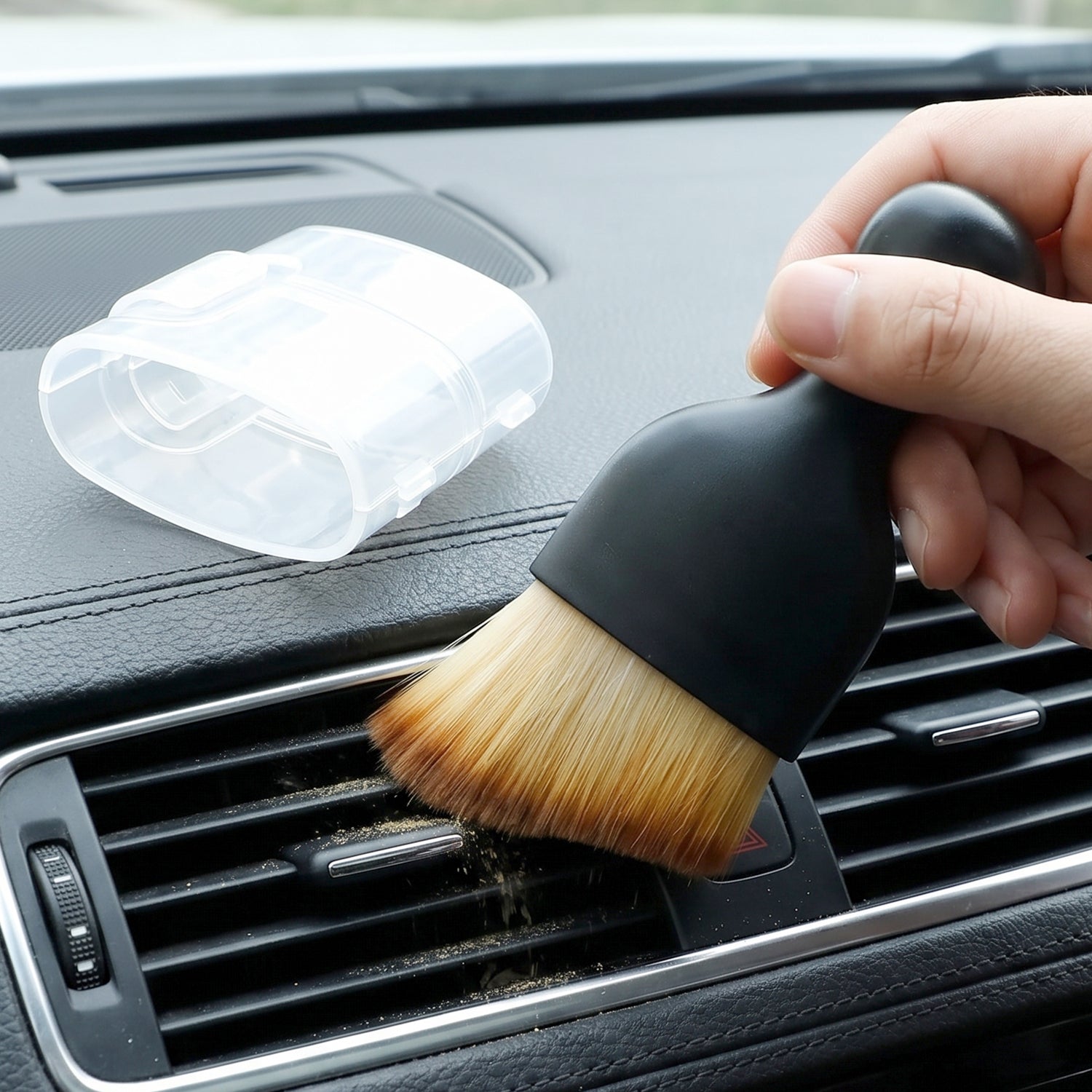Mini car interior cleaning brush with black handle and tan bristles for car vents