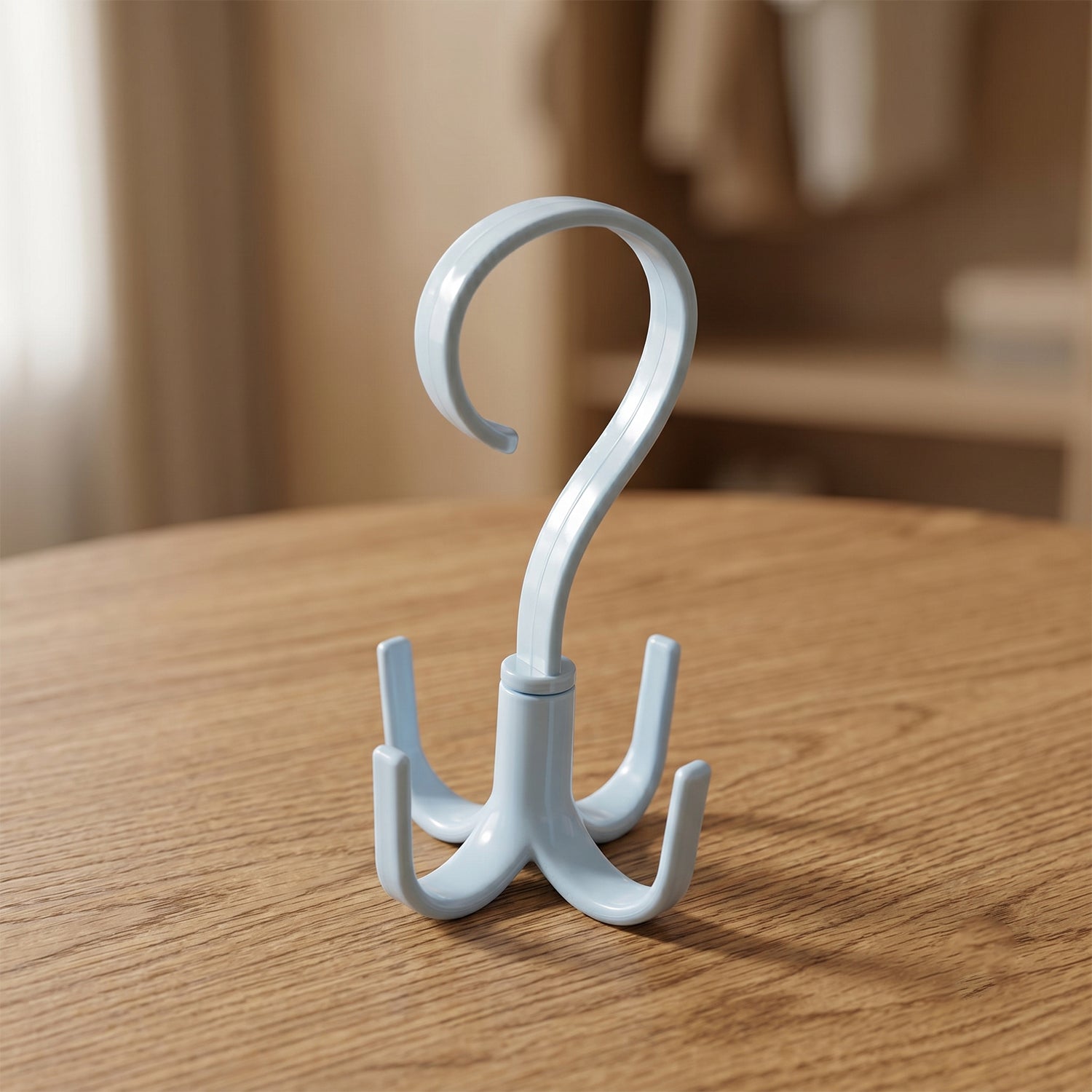 Front view of light blue 360° rotating multipurpose hook hanger with three prongs