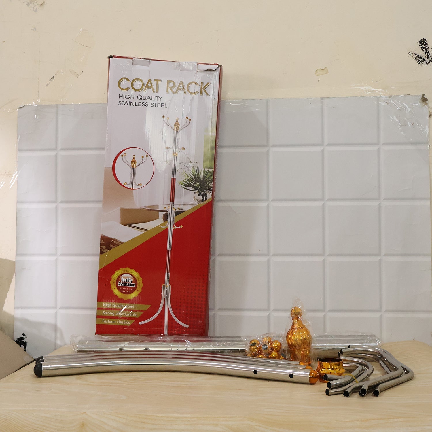 Coat rack stand retail box showing multi hooks, gold tips, and silver metal pole