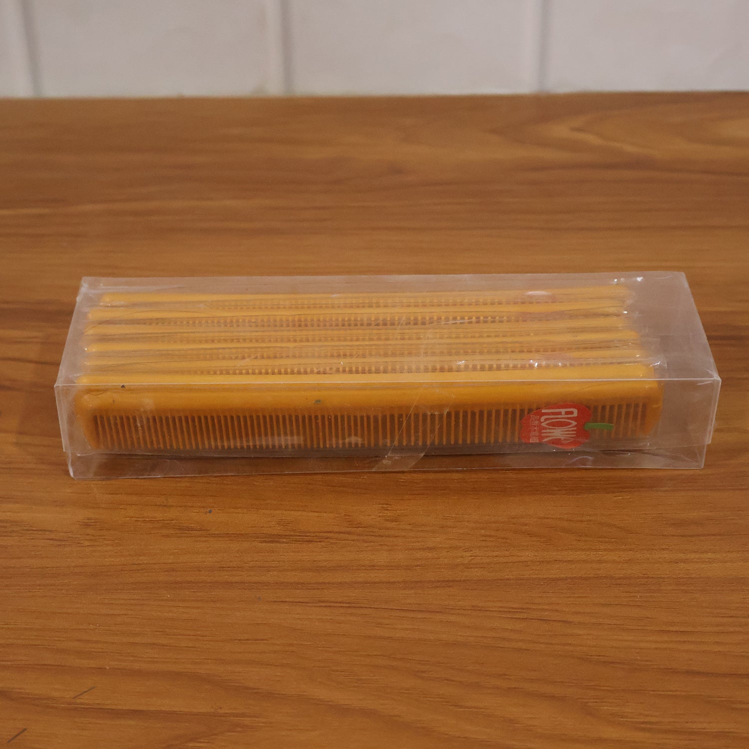 Plastic hair comb set in a clear storage box, multiple combs with fine teeth