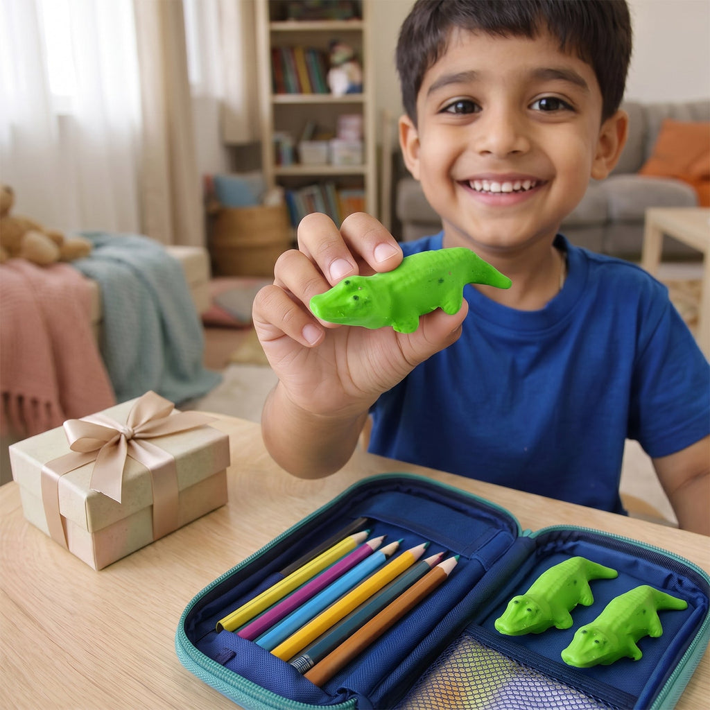 Boy holding a green crocodile eraser over a pencil case