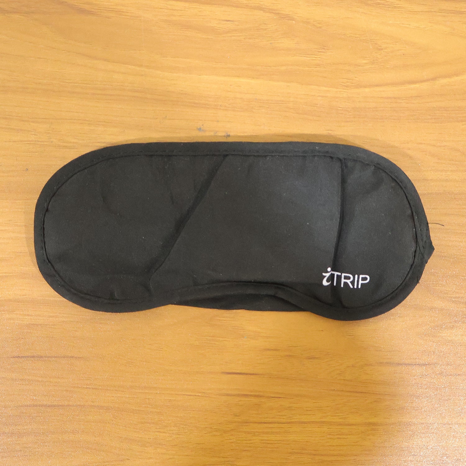 Black light-blocking sleep eye mask with logo, soft padded cover