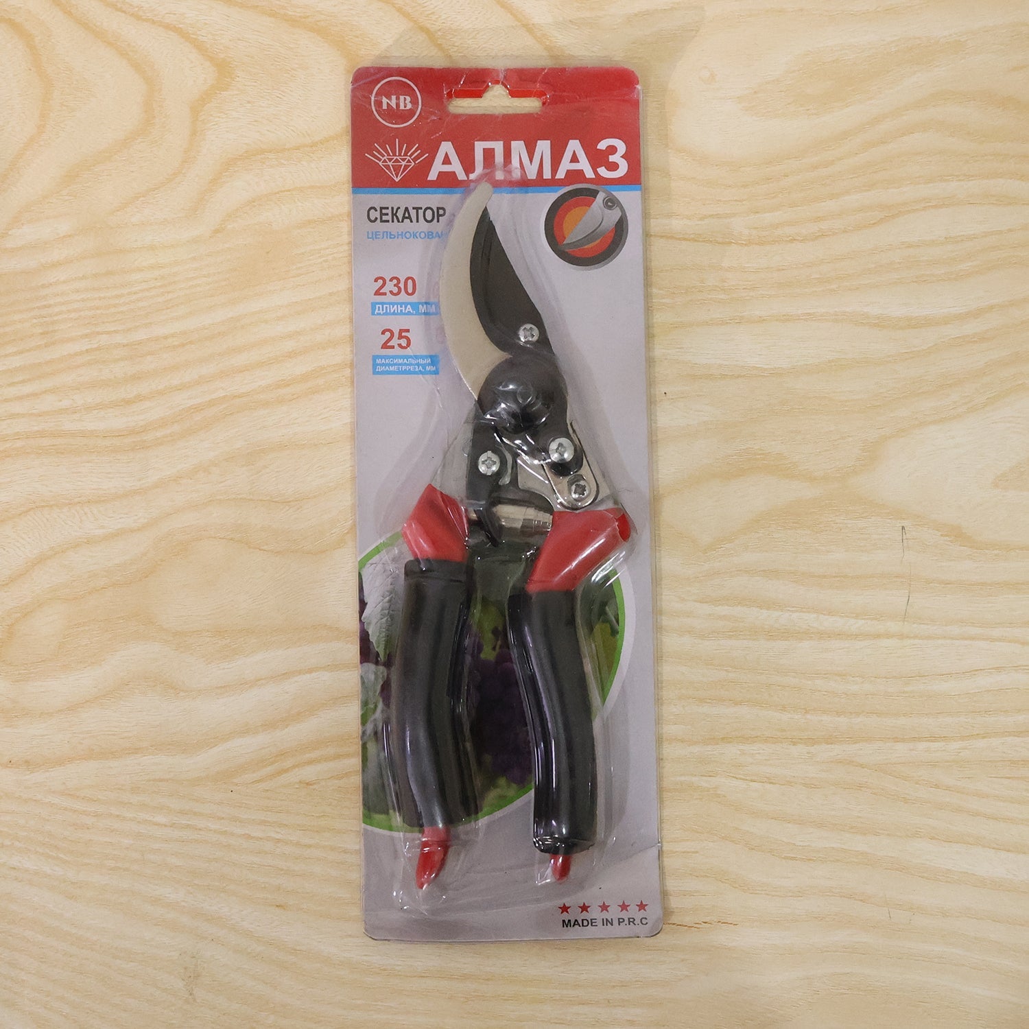 Retail blister pack containing a flower pruning shear with red-and-black handles and steel blades