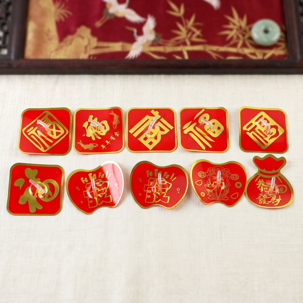 Self-adhesive decorative key hook set on wall, red and gold fortune-style designs