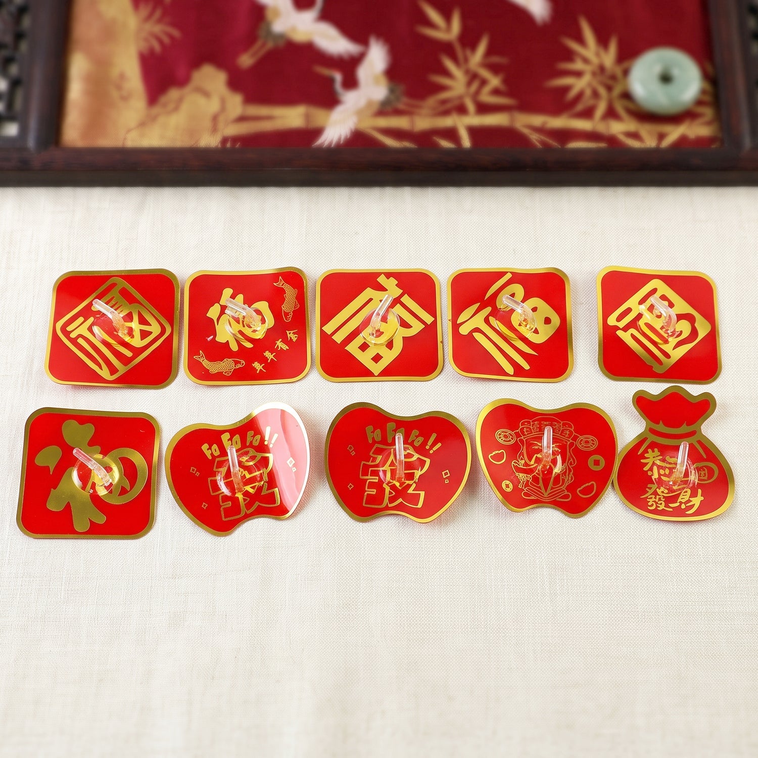Self-adhesive decorative key hook set on wall, red and gold fortune-style designs