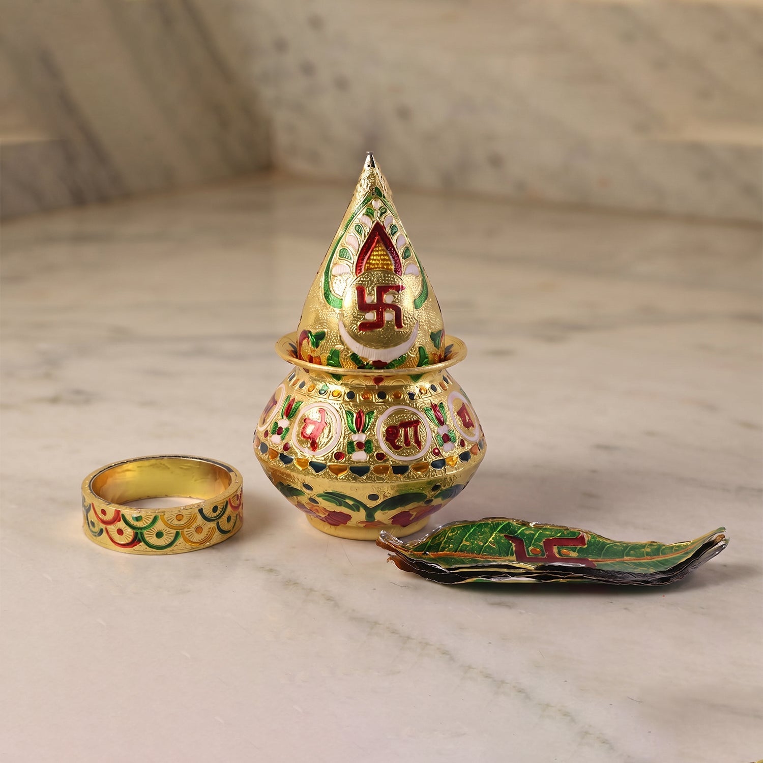 Traditional pooja kalash with green lotus crown, gold painted pot and diya plate