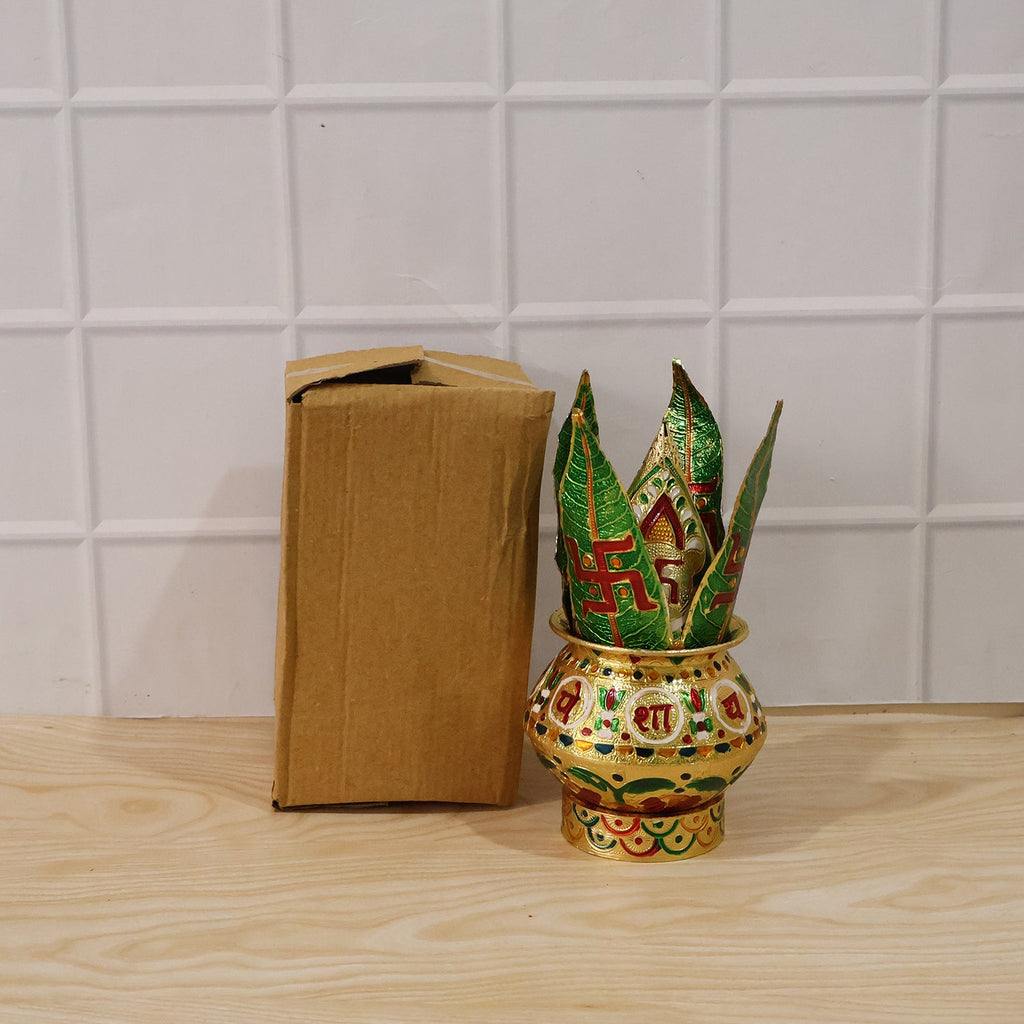 Pooja kalash with green lotus crown beside a plain brown box packaging
