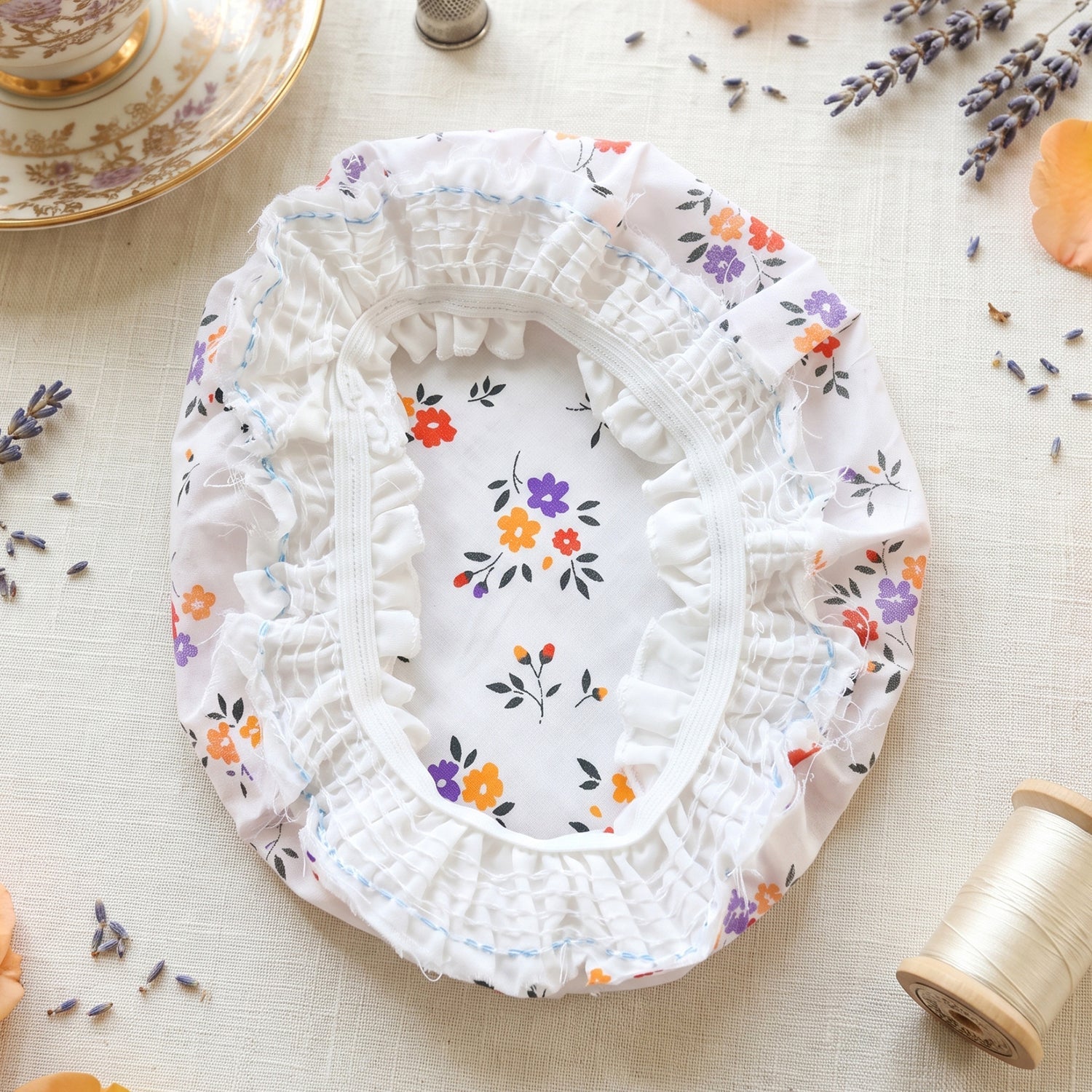 Cotton matka cover close-up, gathered white fabric with floral pattern