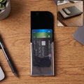 Black leather business card holder with clear window sleeve and slim steel case