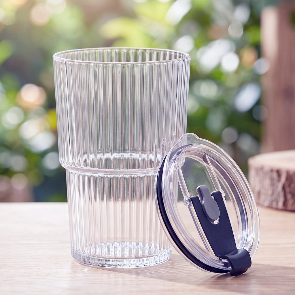 Clear plastic tumbler and separate lid piece with straw holder, reusable cup