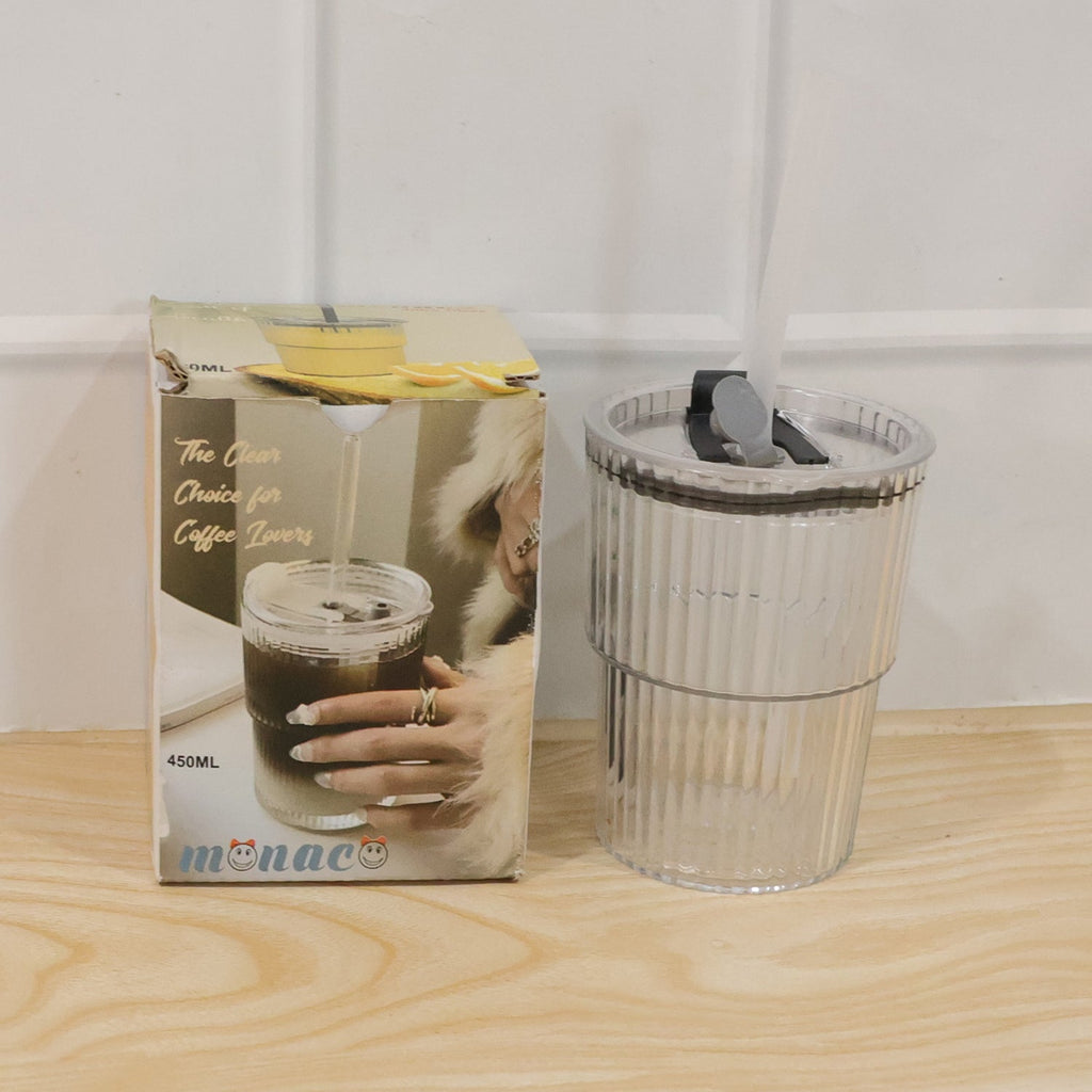 Clear plastic tumbler with lid and straw, shown beside 450ml package