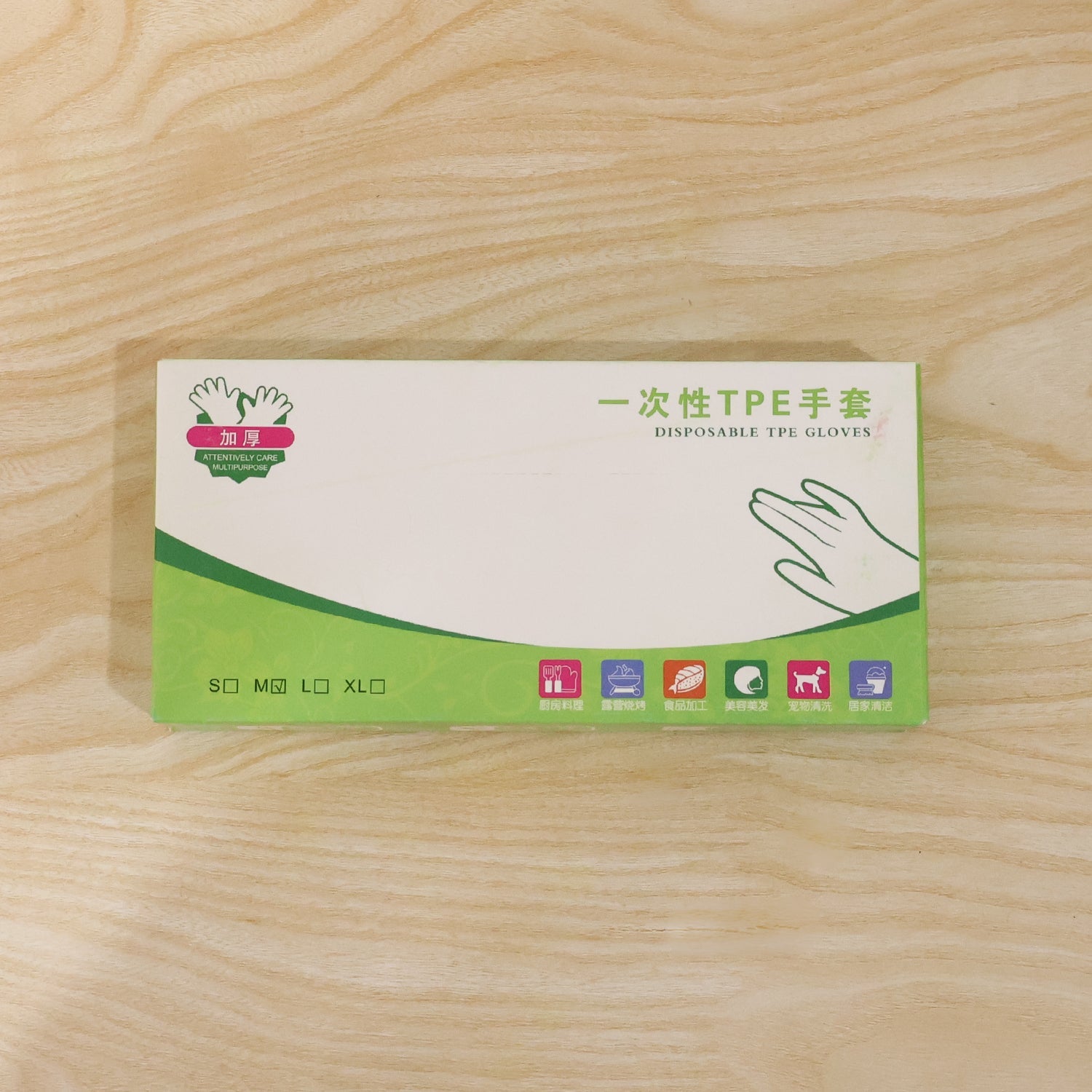 Box of disposable plastic gloves with size options shown