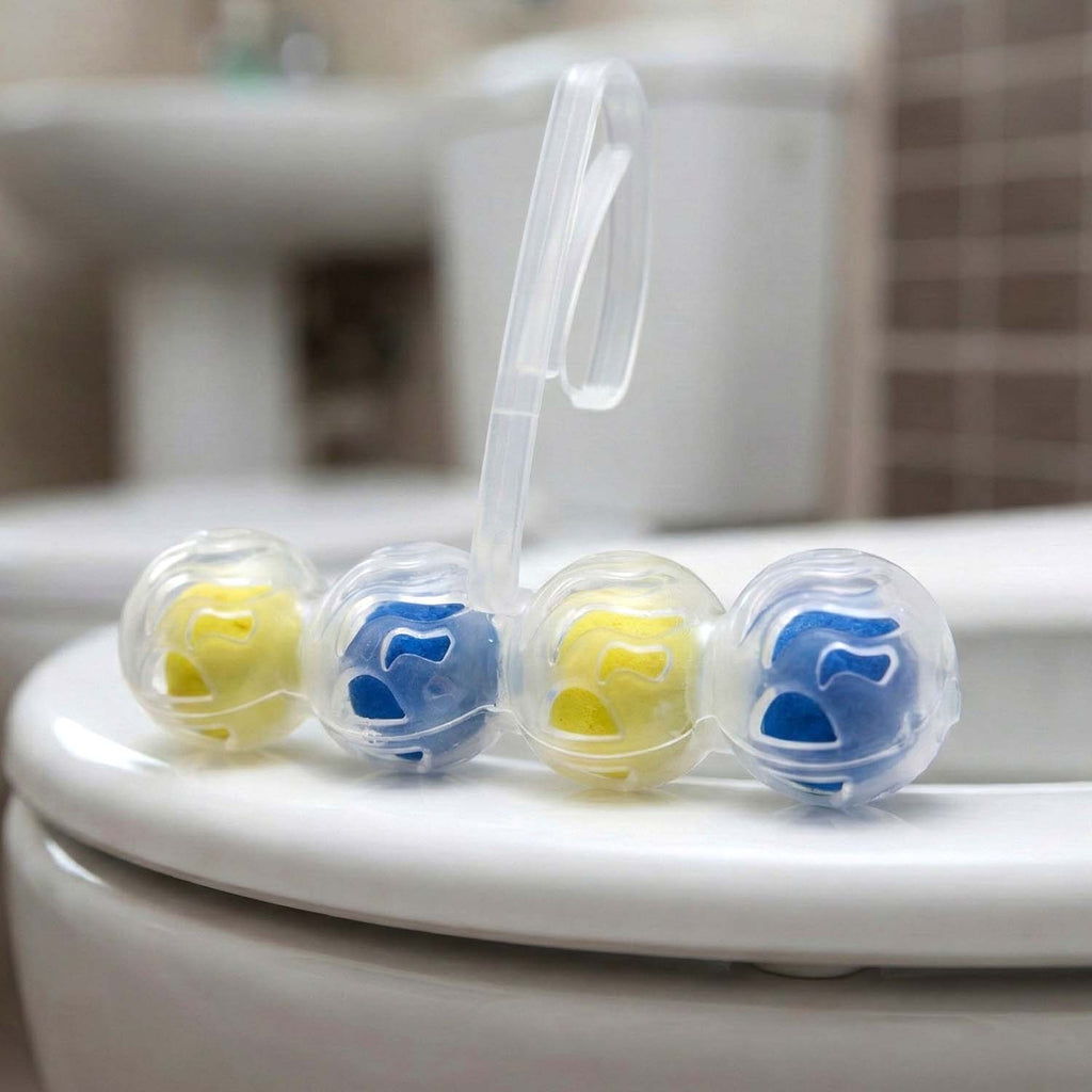 Toilet cleaning balls in dual-action dispenser, blue and yellow refill spheres