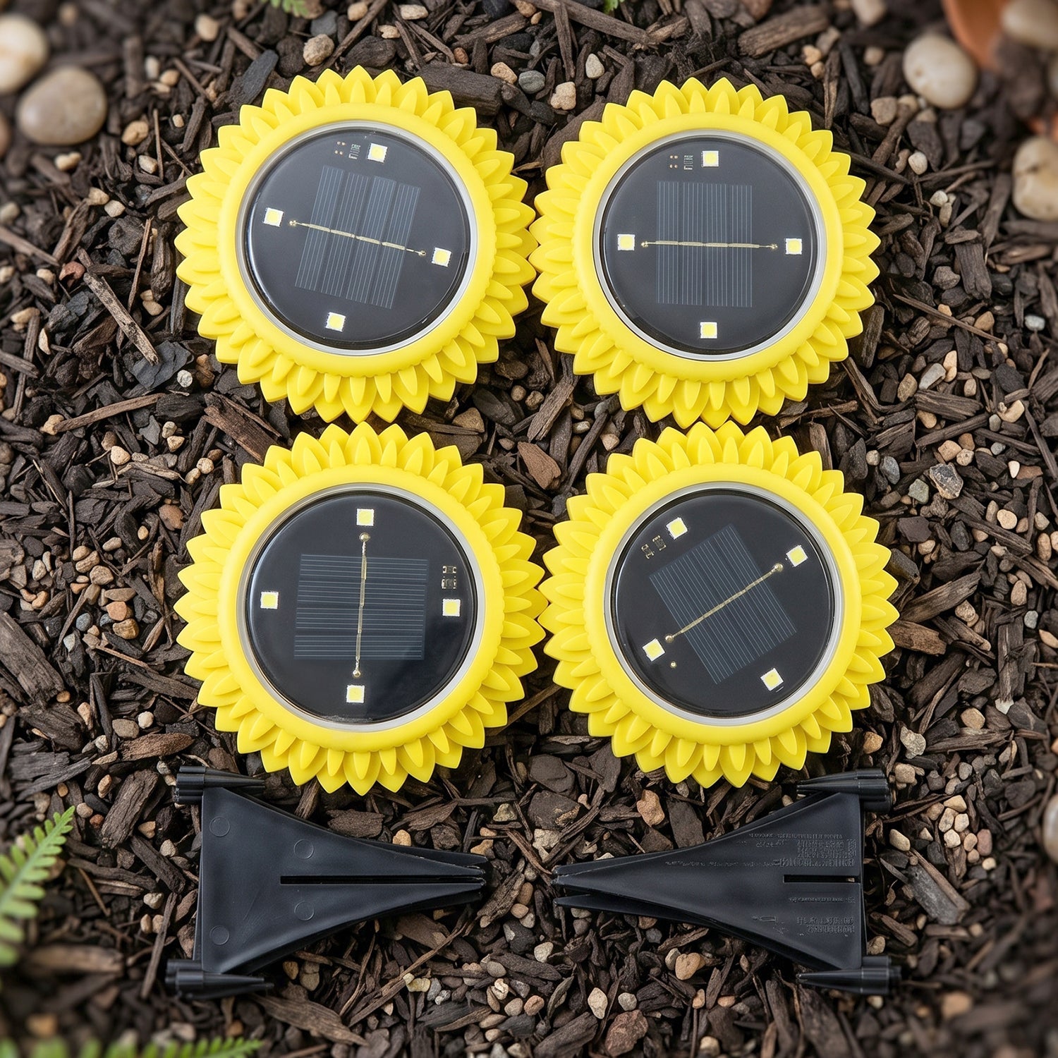 Four sunflower solar light heads with black panels and yellow petal edges