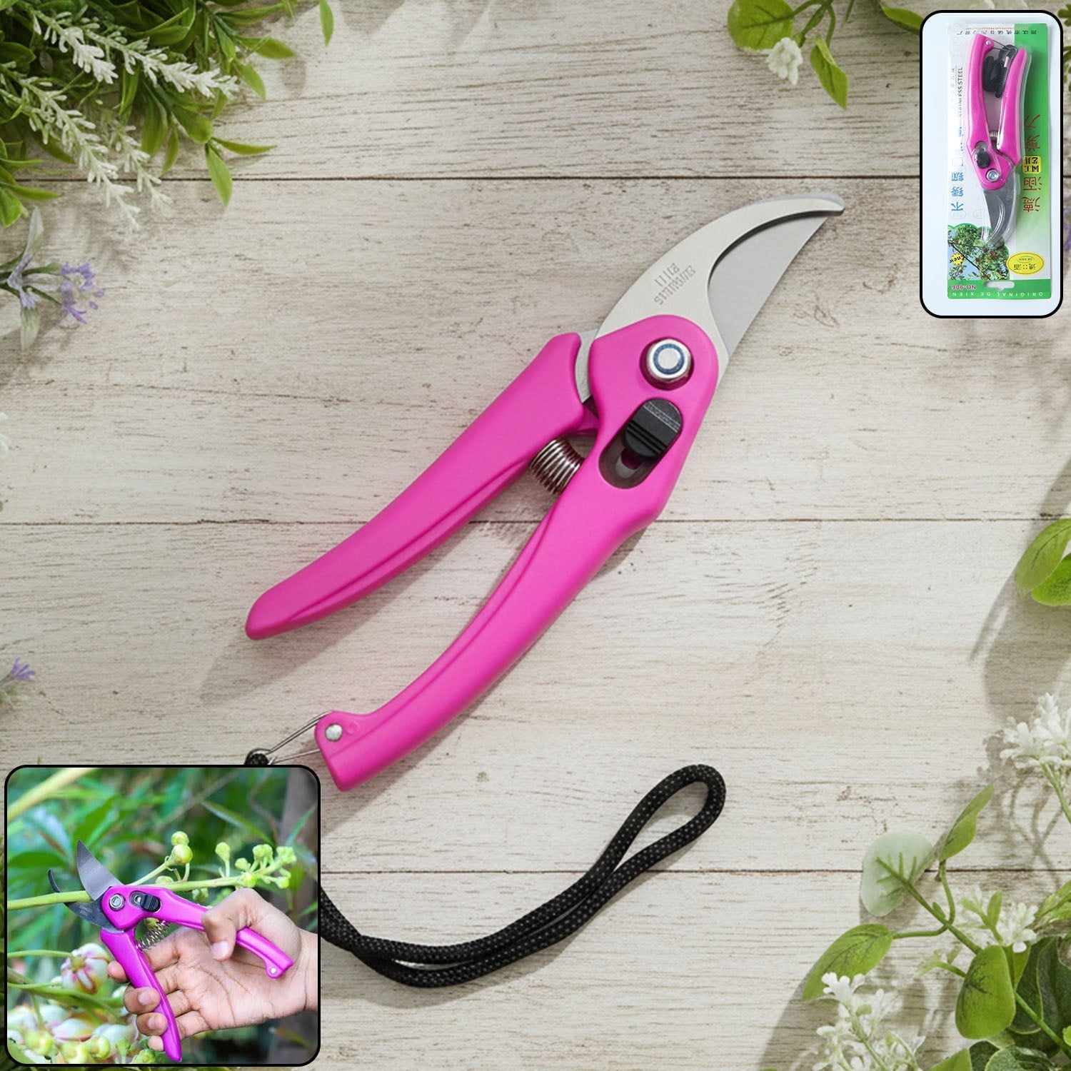 Pink pruning scissors with stainless steel blades and black wrist strap on a wooden surface
