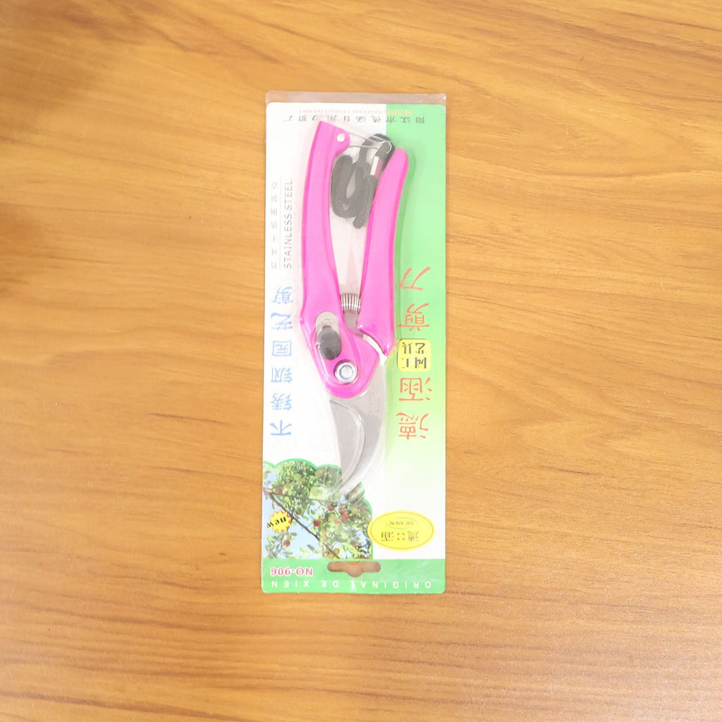 Blister-packaged pink garden pruning scissors with stainless steel blades and wrist strap