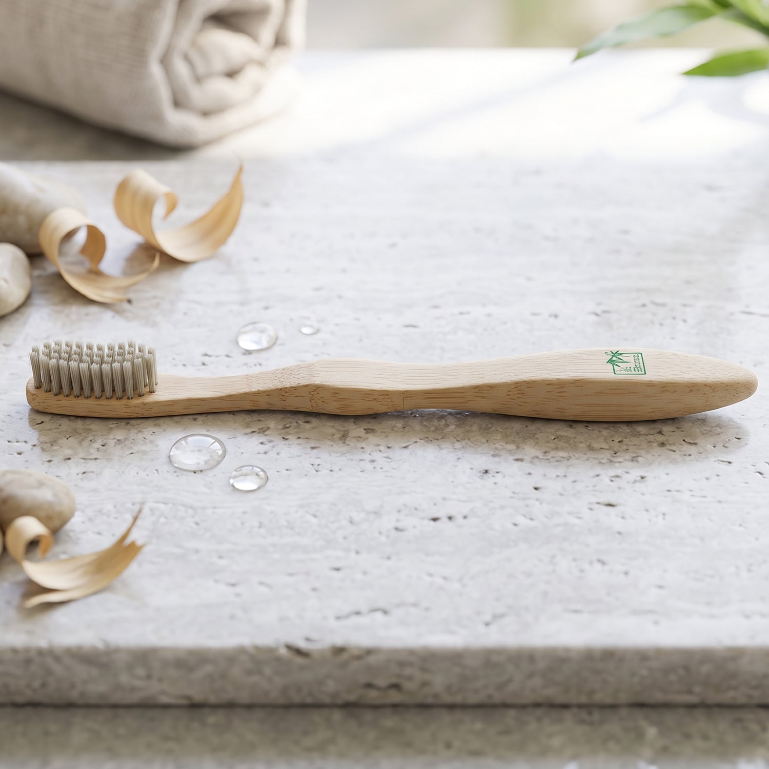 Soft bristle bamboo toothbrush with long wooden handle, side view