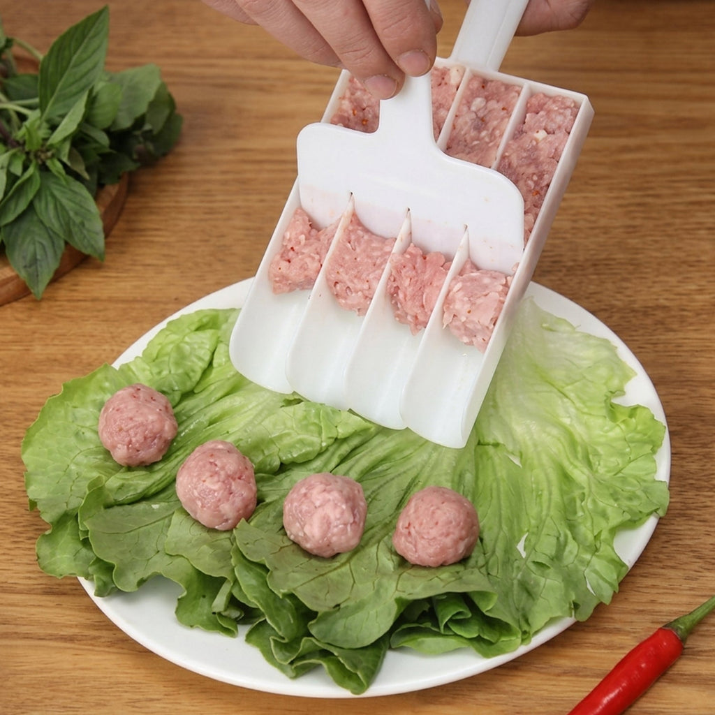 Fritter maker scoop dispensing from white multi-cavity tray onto lettuce with balls (XcelCraft)