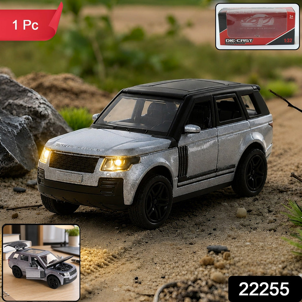 Die-cast pull-back SUV toy, gray and black, close front view with glowing headlights