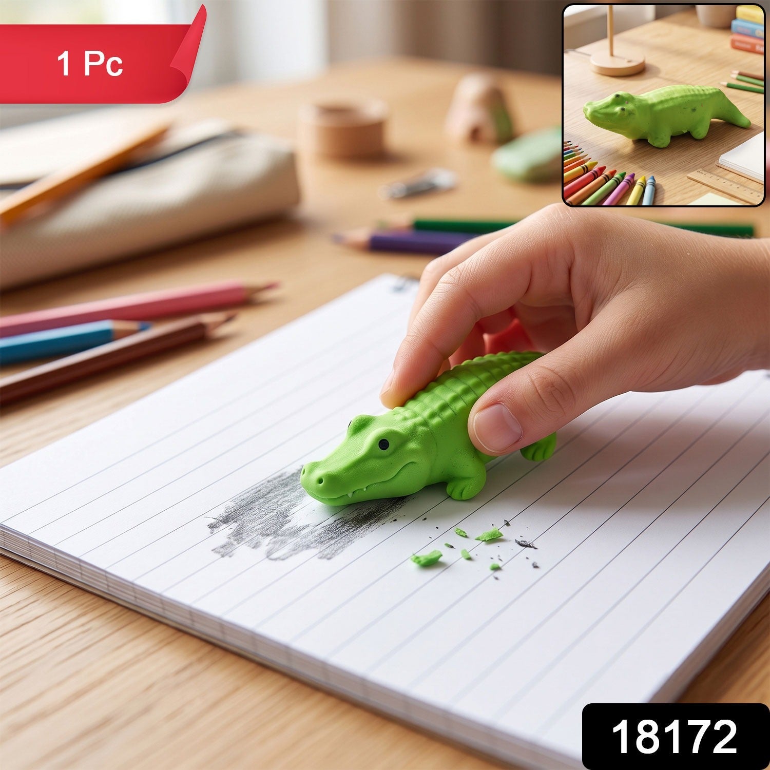 Green crocodile eraser held to rub out pencil marks on lined paper