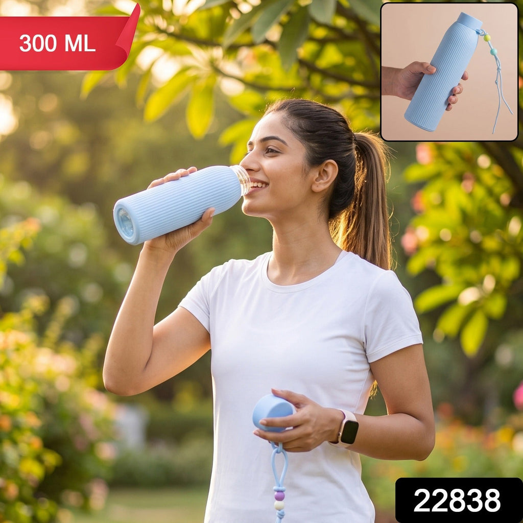 Light blue ribbed glass water bottle, 300 ml, with silicone lid and carry loop