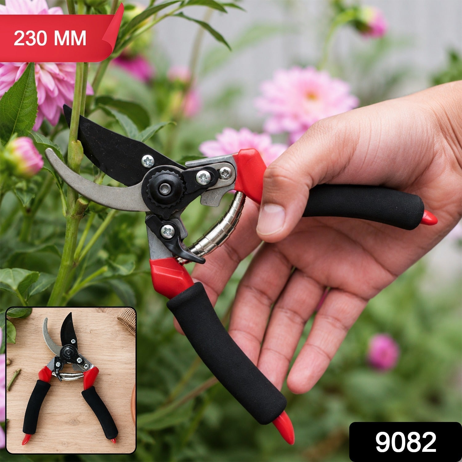 Bypass pruner with black grips, red housing, and stainless steel blades in hand